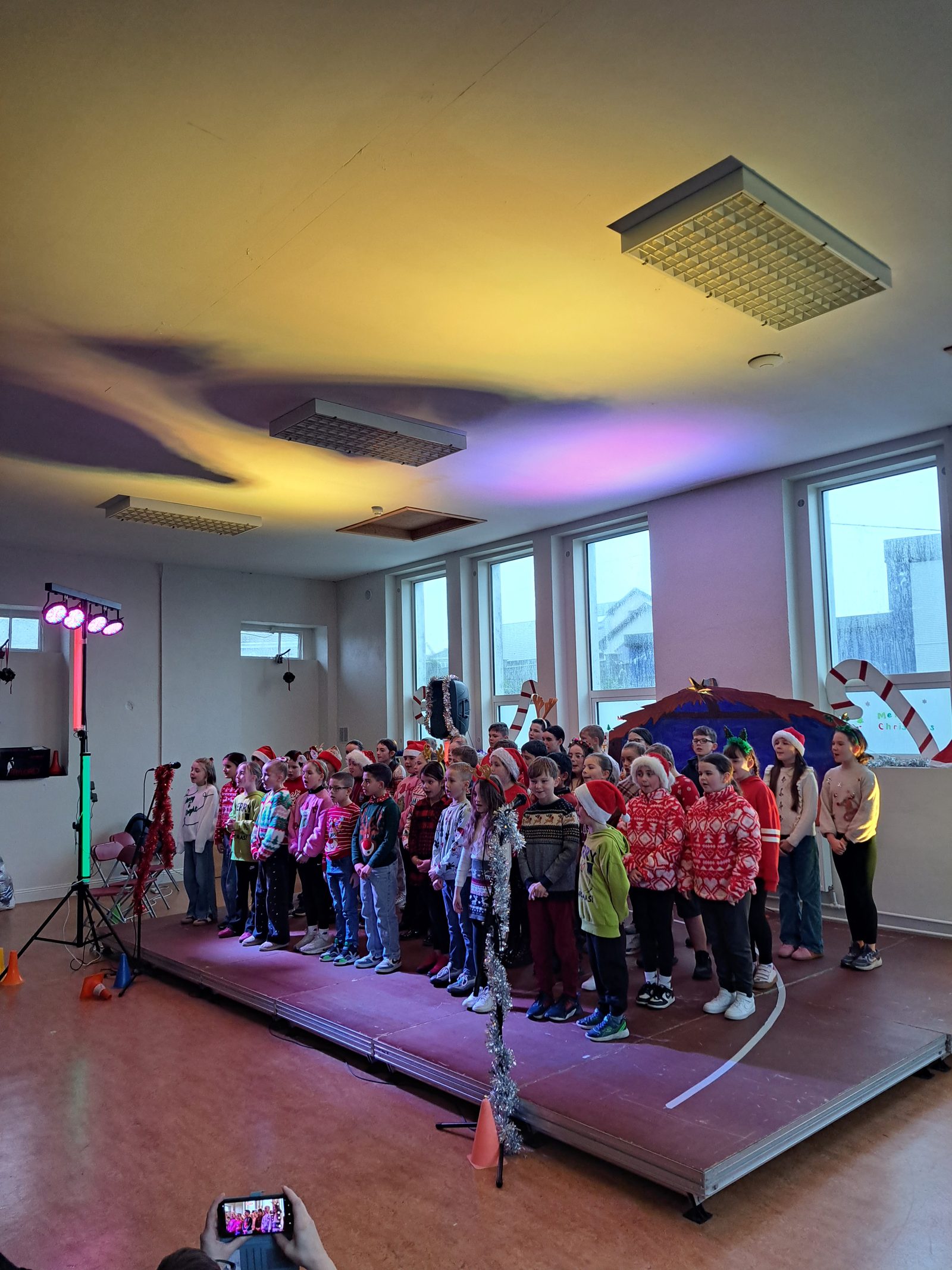 Pupils on Christmas jumper day in the school hall